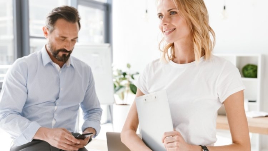 confident-man-manager-using-mobile-phone-PKUB4RV@2x